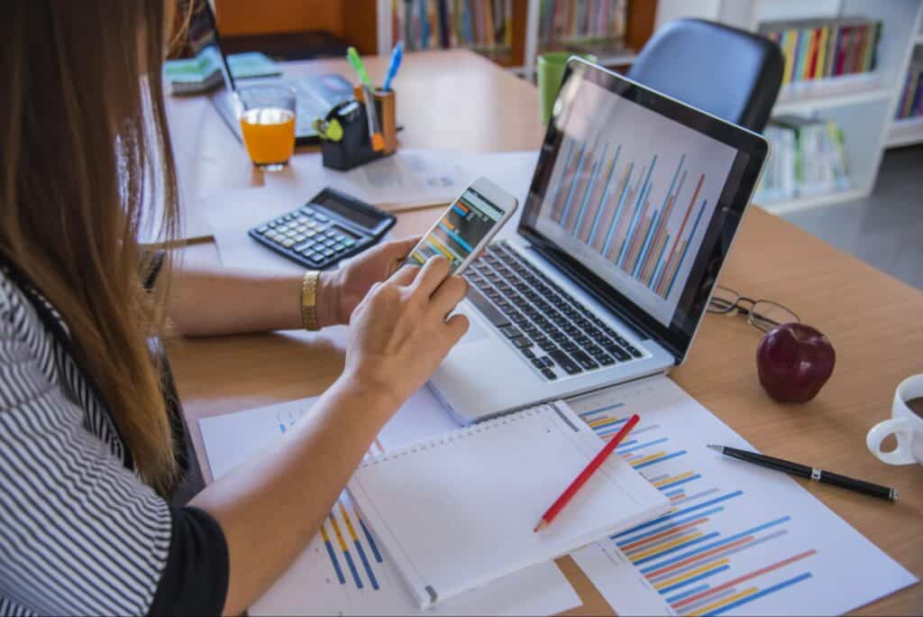 women working on mobile and laptop