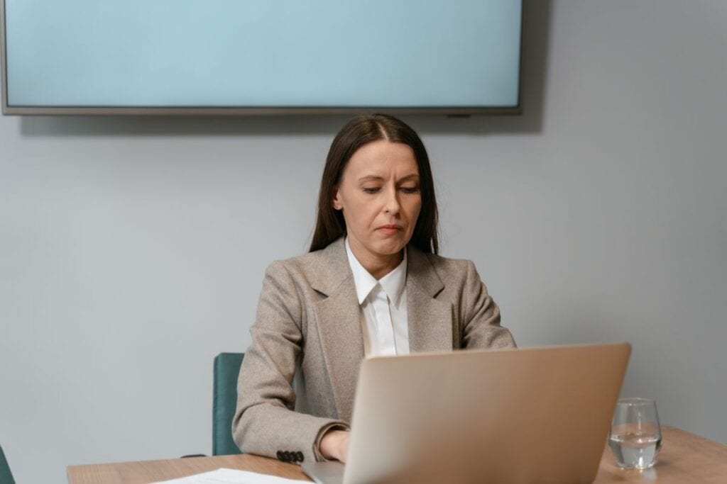 Fractional content marketing manager reviewing strategy on a laptop