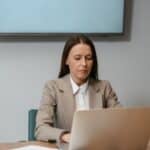 Fractional content marketing manager reviewing strategy on a laptop