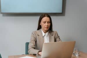 Fractional content marketing manager reviewing strategy on a laptop